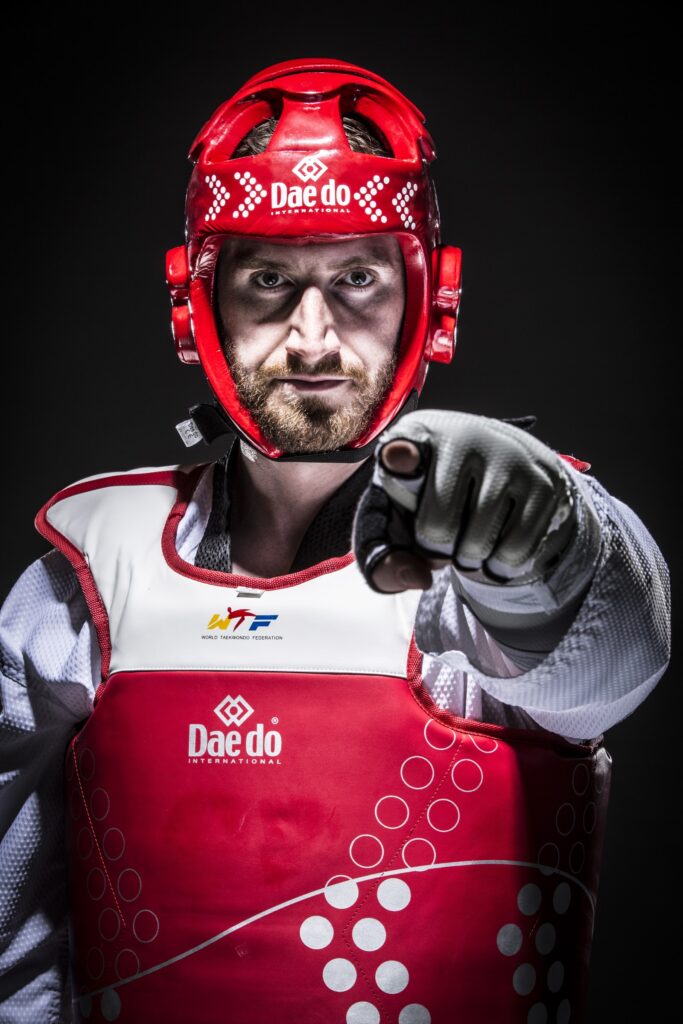 Stephen Lambdin in competition gear pointing at the camera