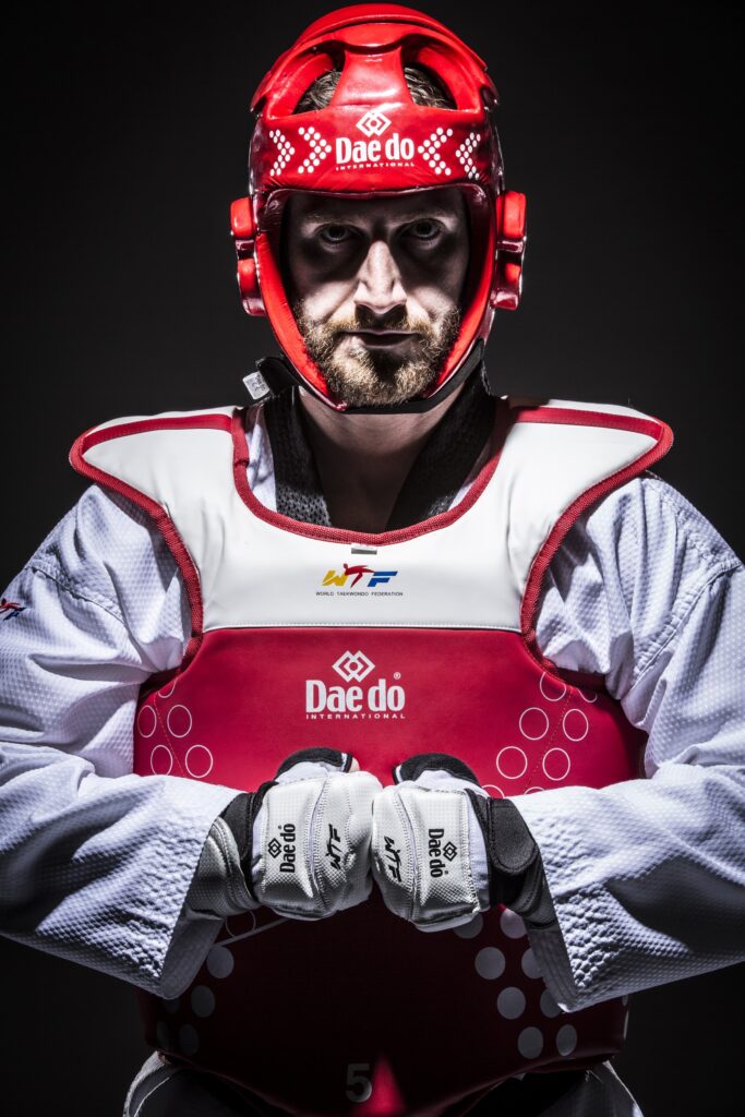 Stephen Lambdin in red competition gear and headgear